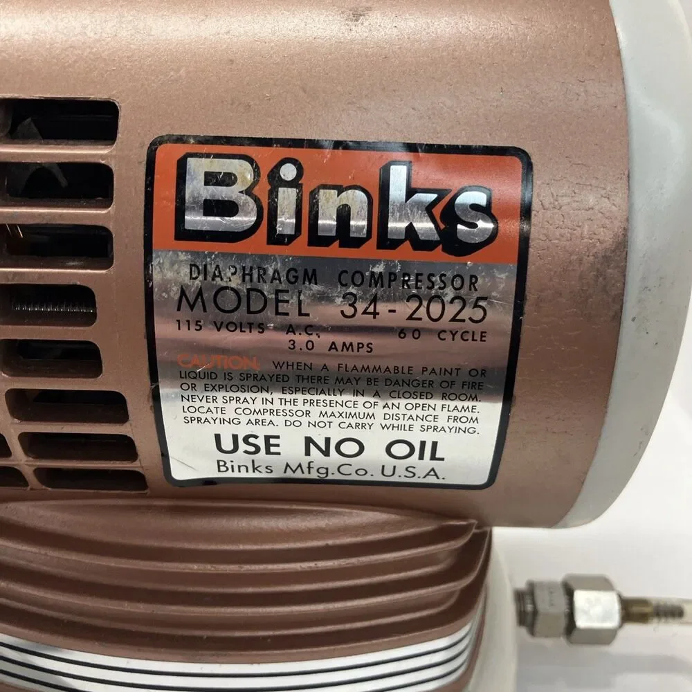 Binks Diaphragm Compressor Model 34-2025  Works well.  110 VAC.  Hose included